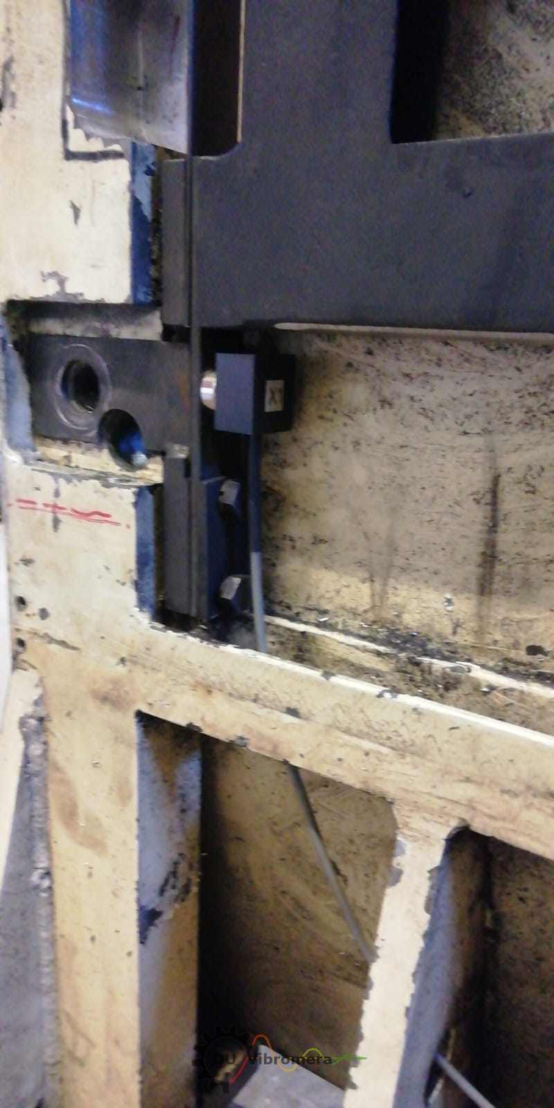 Close-up of a soft-bearing balancing machine's roller support.