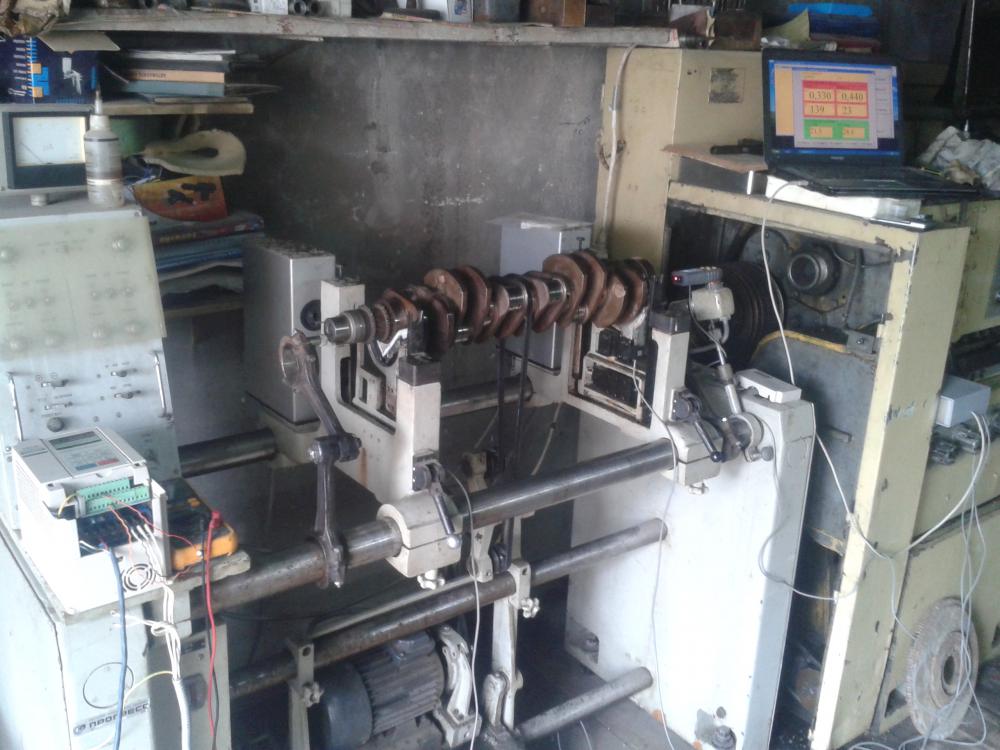 Close-up of the integration of Balanset-1A OEM into the control system of an old balancing stand.